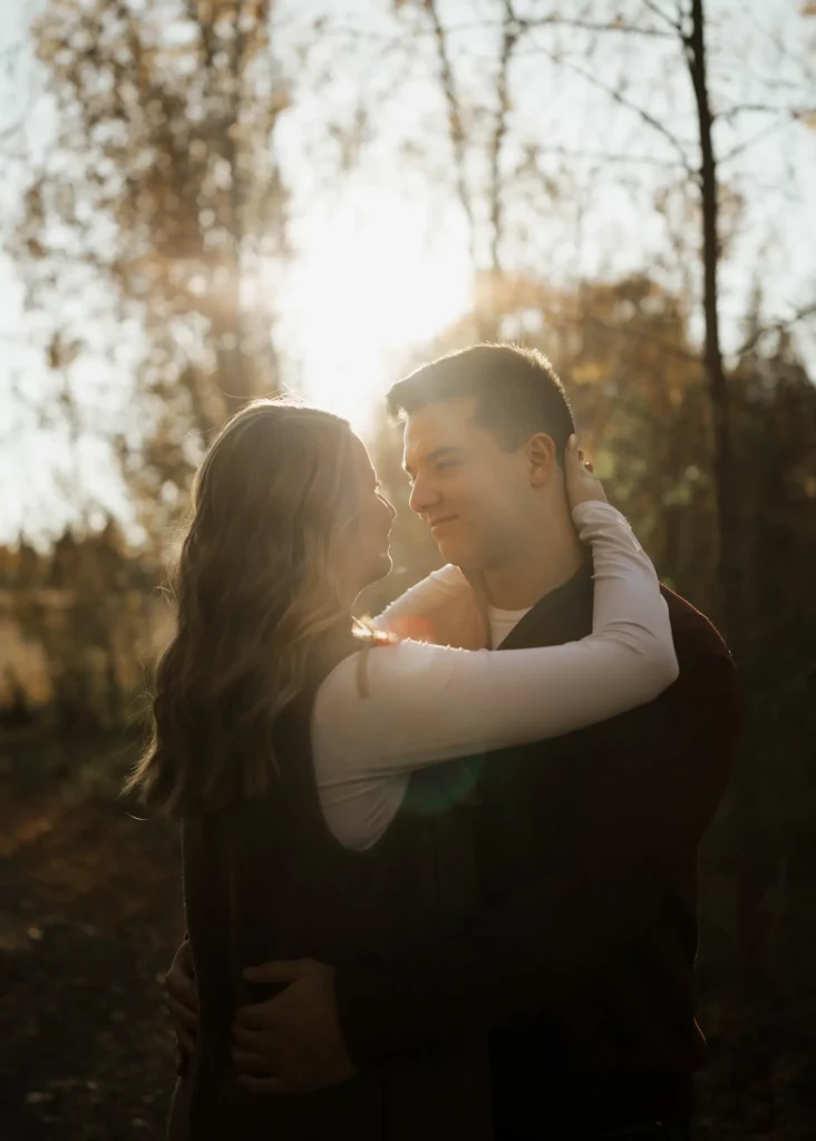 engagment photos of a couple in the fall on a path in the edmonton river valley