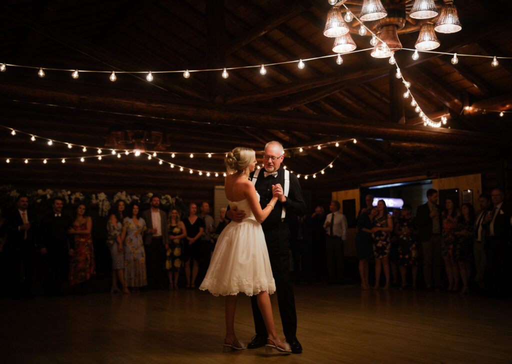 bride and father in the middle of dance floor sharing their father-daughter dance